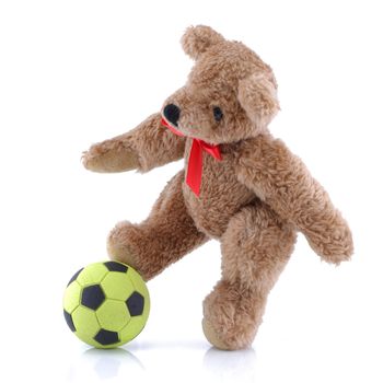 A Teddy bear playing football soccer on white background