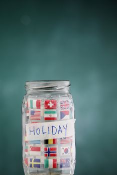 glass jar filled up with international flags