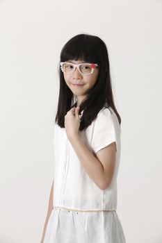 chinese girl with cute eyeglasses looking at camera