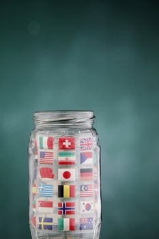 glass jar filled up with international flags