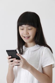 chinese girl sending text message with mobile phone