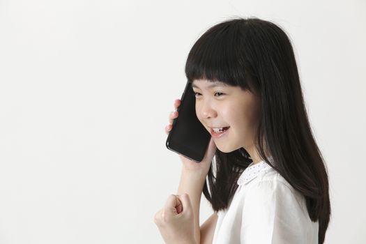 close up of the chinese girl talking with cellphone