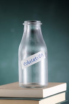 empty glass jar labelled with text education