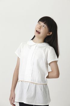 chinese girl with surprise expression and looking up