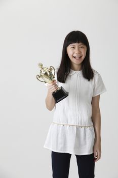 girl happy to own a trophy