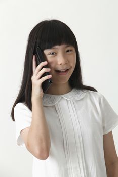 chinese girl talking with cellphone looking at camera