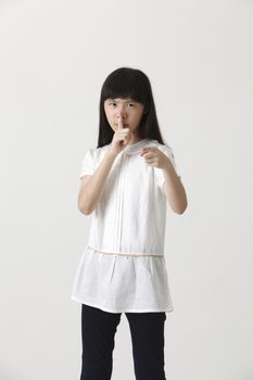 chinese girl with silent gesture 
