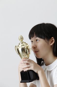 girl happy to own a trophy