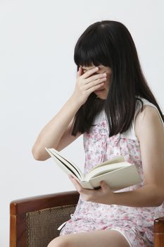 chinese girl reading horrible story