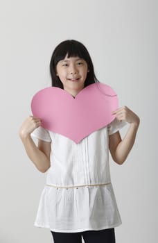 chinese girl holding a blank heart shape cardboard