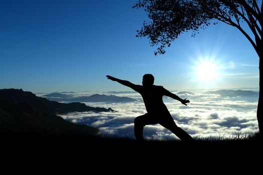 silhouette elderly obese men doing yoga on the mountain