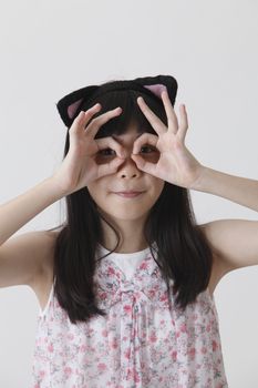 chinese girl wearing cute hair band looking at camera