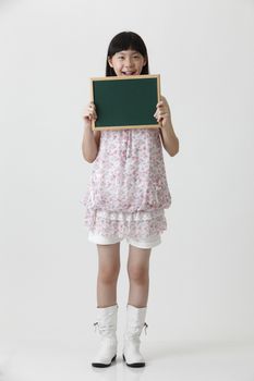chinese girl holding a small chalk board