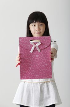 chinese girl holding a present bag