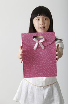 chinese girl holding a present bag