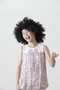 chinese girl wearing a big black wig laughing