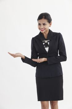 front view of indian businesswoman showing direction