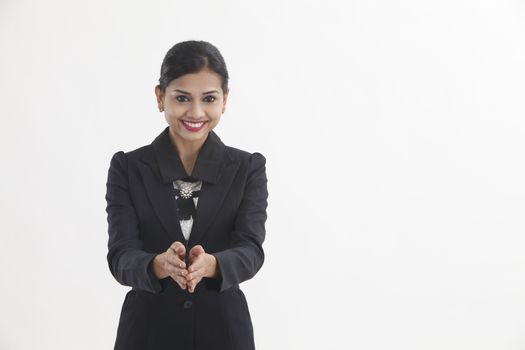 front view of the businesswoman with hand gesture greeting