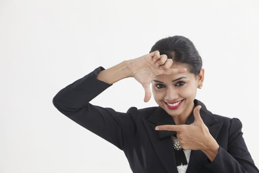 picture of lovely woman creating a frame with fingers