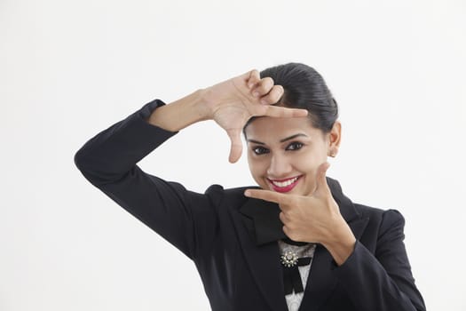 picture of lovely woman creating a frame with fingers