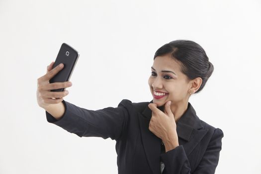 Front view business woman self portrait with smart phone