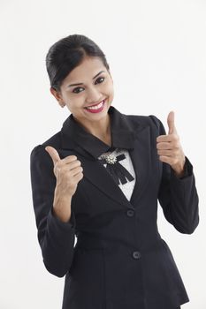  formal Asian Business woman with thumbs up