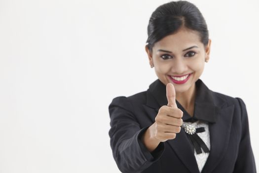  formal Asian Business woman with thumbs up