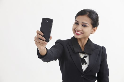 Front view business woman self portrait with smart phone