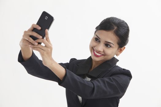 Front view business woman self portrait with smart phone