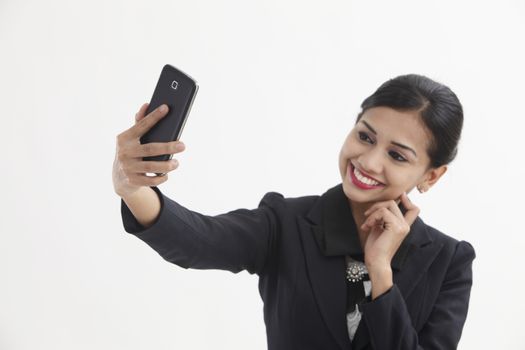 Front view business woman self portrait with smart phone