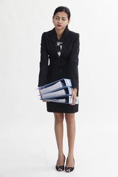 business woman holding a stack of file