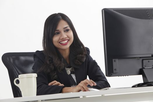 business woman sitting in front monitor