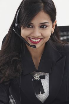 beatiful receptionist wearing head set talking