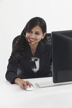 beatiful receptionist wearing head set talking