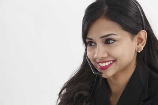 beatiful receptionist wearing headset smiling