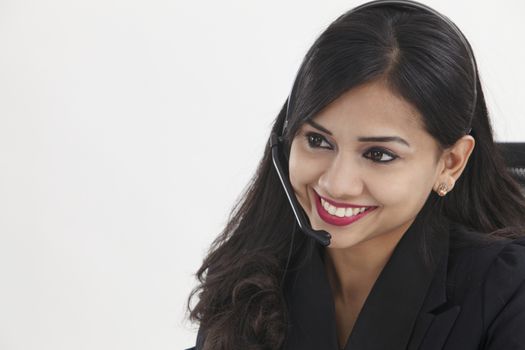 beatiful receptionist wearing headset smiling