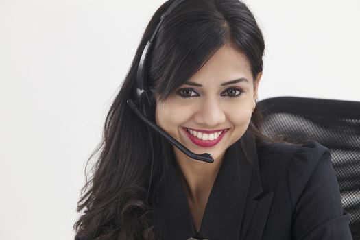 beatiful receptionist wearing headset smiling