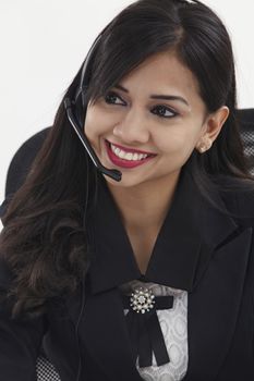 beatiful receptionist wearing head set talking