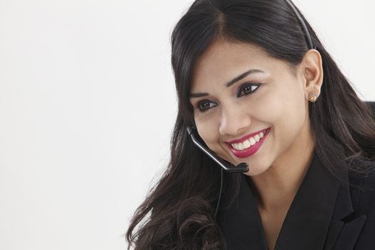 beatiful receptionist wearing headset smiling