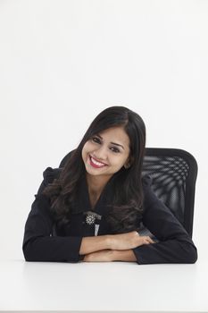 businesswoman sitting and looking to the camera