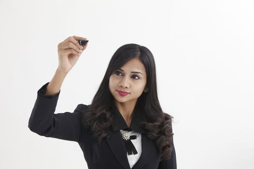 businesswoman holding a marker pen doing presentation