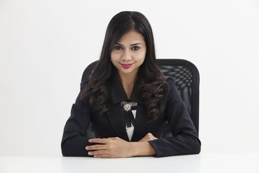 businesswoman sitting and looking to the camera