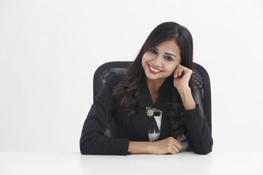 businesswoman sitting and looking to the camera