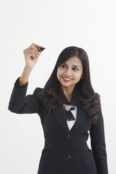 businesswoman holding a marker pen doing presentation