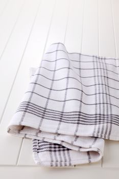 checkered napkin on wooden white  table