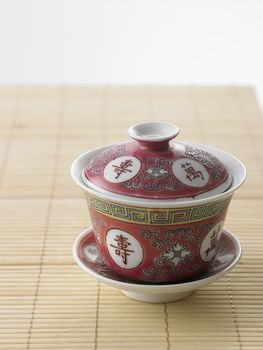 chinese tea cup on the bamboo mat