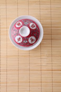 Japanese white tea pot on the bamboo mat