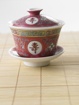 chinese tea cup on the bamboo mat