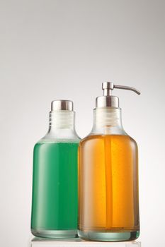 cleanser and shampoo in the glass container