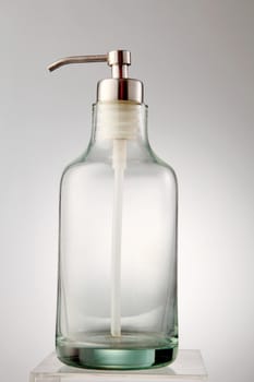 empty glass dispenser on the white background